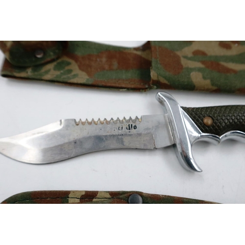 2027 - Modern hunting knife in a camouflage sheath, with a throwing knife by Survival Boy and another (3). ... 