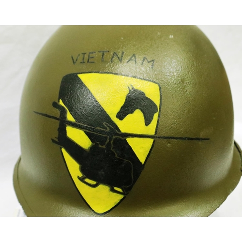 2177 - An American Vietnam war period M1 helmet, later painted with 1st Cavalry Division emblem. P&P Group ... 