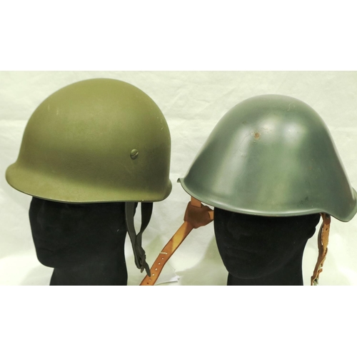 2182 - East German helmet with leather liner and a further example (2). P&P Group 3 (£25+VAT for the first ... 