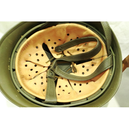 2182 - East German helmet with leather liner and a further example (2). P&P Group 3 (£25+VAT for the first ... 