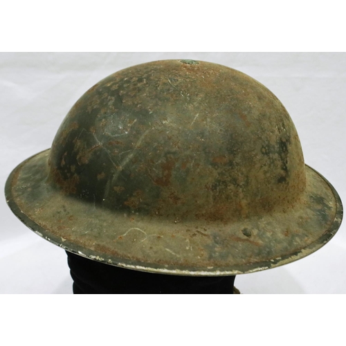 2190 - British WWII Brodie helmet with liner and canvas chin strap. P&P Group 2 (£18+VAT for the first lot ... 