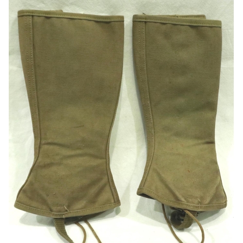 2202 - A pair of American WWII GI issue canvas gaiters, dated 1943 with laces and canvas straps. P&P Group ... 