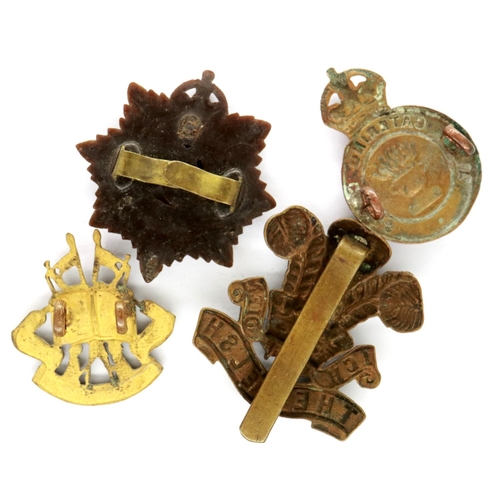 2293 - Four WWII cap badges. P&P Group 1 (£14+VAT for the first lot and £1+VAT for subsequent lots)