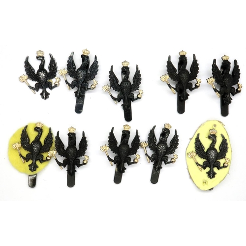 2316 - Nine Kings Royal Regiment cap badges. P&P Group 1 (£14+VAT for the first lot and £1+VAT for subseque... 