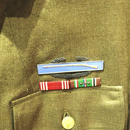 2238 - American WWII tunic of the 103rd Infantry Division, several areas of moth damage throughout. P&P Gro... 