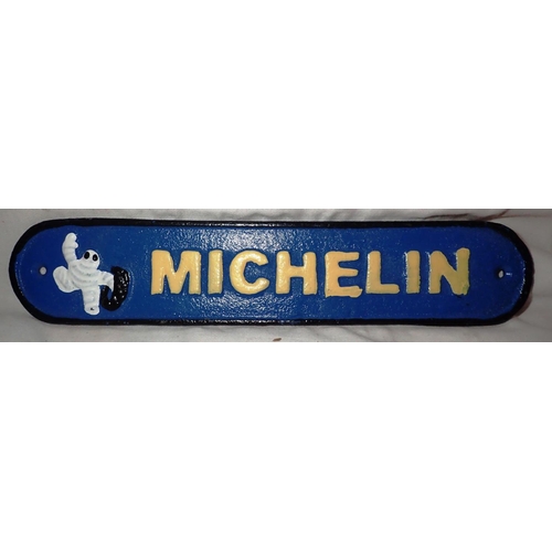 1054 - Cast iron Michelin sign, W: 20 cm. P&P Group 1 (£14+VAT for the first lot and £1+VAT for subsequent ... 