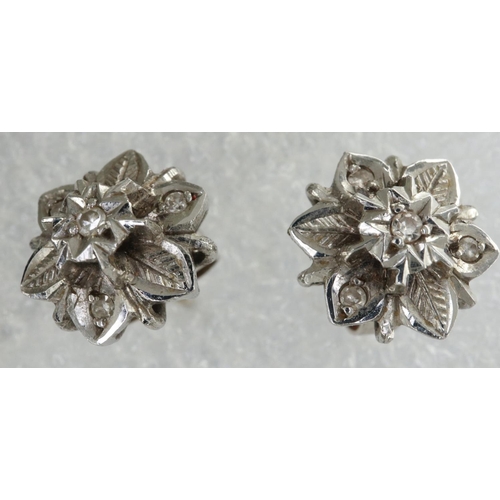 12 - Pair of 18ct white gold diamond set flower stud earrings, 2.9g. P&P Group 1 (£14+VAT for the first l... 