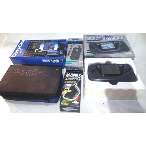 2063 - Sega Game Gear handheld game system, battery pack, aftermarket carry case and aftermarket mains adap... 