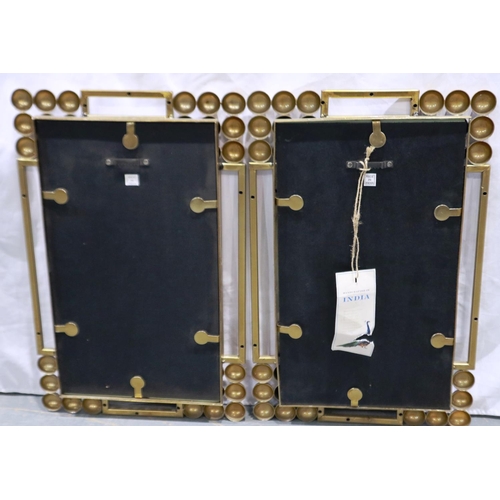 2062 - A pair of modernist brass framed wall mirrors, each overall 32 x 50 cm. Not available for in-house P... 