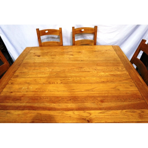 2126 - A substantial golden oak dining table with a set of four ladder back chairs, table 160 x 160 x 79 cm... 