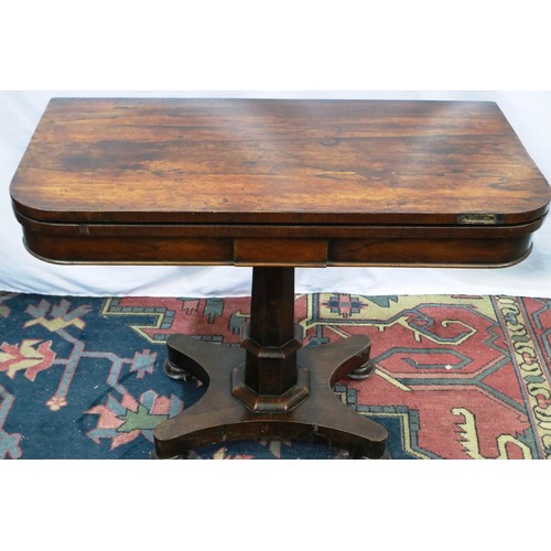 2116 - A 19th century rosewood games table with foldover top, tapering pedestal and quatrifoil support, 91 ... 