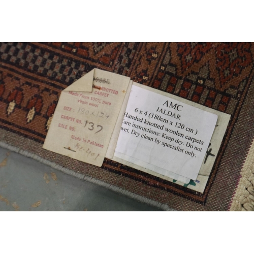 2071C - A 20th century Middle Eastern hand knotted floor rug, fringed, 180 x 120 cm. Not available for in-ho... 