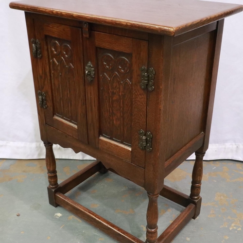 2131 - A 20th century oak two door cabinet in the Priory style, 51 x 33 x 78 cm H. Not available for in-hou... 