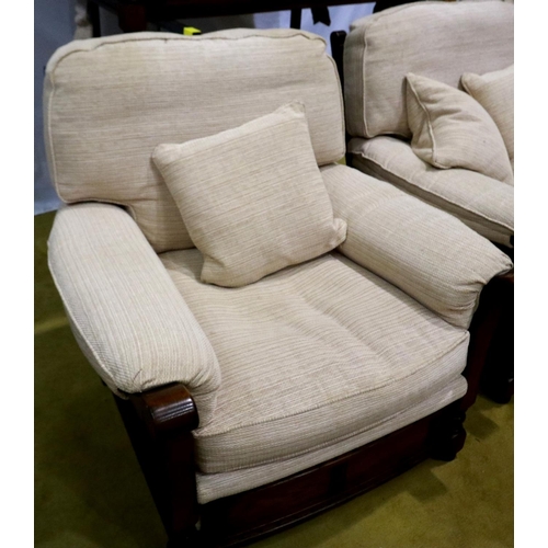 2149 - A modern oak framed lounge suite, each frame carved with linenfold decoration, upholstered in cream ... 