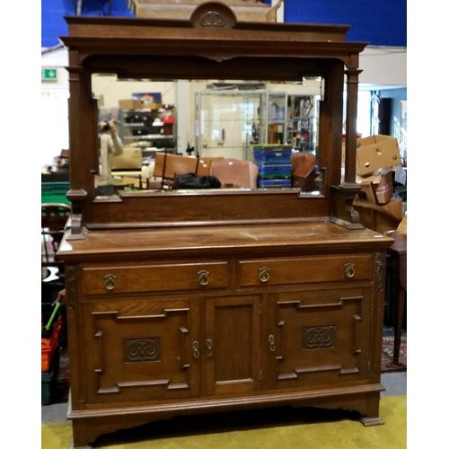 2153 - A Victorian mahogany mirror-back dresser, with carved and panelled doors, two drawers and bevelled g... 