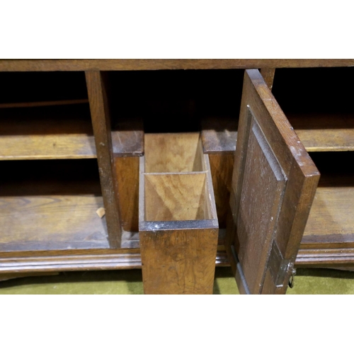 2153 - A Victorian mahogany mirror-back dresser, with carved and panelled doors, two drawers and bevelled g... 