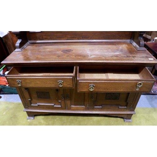 2153 - A Victorian mahogany mirror-back dresser, with carved and panelled doors, two drawers and bevelled g... 