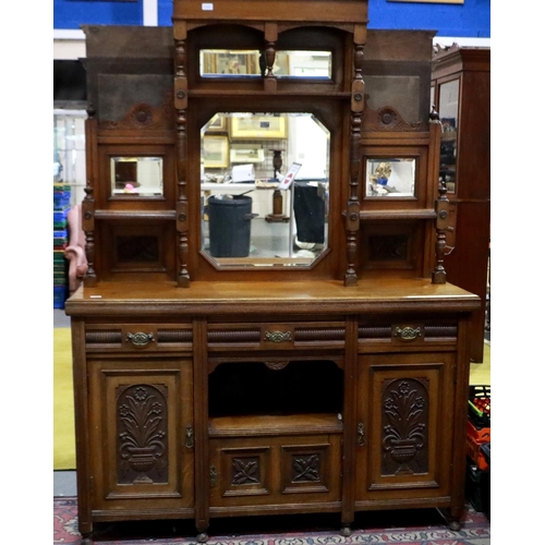 2154 - A late 19th century oak dresser, with mirrored upstand, above a sideboard base of cupboards and draw... 