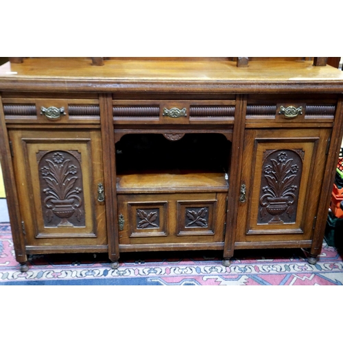 2154 - A late 19th century oak dresser, with mirrored upstand, above a sideboard base of cupboards and draw... 