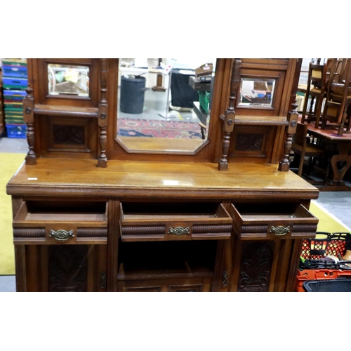 2154 - A late 19th century oak dresser, with mirrored upstand, above a sideboard base of cupboards and draw... 