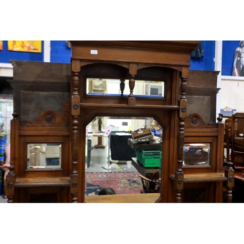 2154 - A late 19th century oak dresser, with mirrored upstand, above a sideboard base of cupboards and draw... 