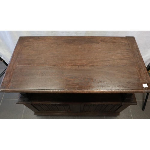 2157 - An early 20th century oak Monks bench, with hinged seat and carved arm rails, 89 x 45 x 77 cm H. Not... 