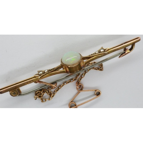 16 - 9ct gold brooch set with an opal and seed pearls, L: 60 mm, 3.2g. P&P Group 1 (£14+VAT for the first... 