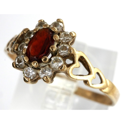 20 - 9ct gold cluster ring set with garnet and cubic zirconia with pierced heart shoulders, size O, 1.4g.... 