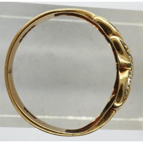 29 - 9ct gold crossover ring set with diamonds, size K/L, 1.9g. P&P Group 1 (£14+VAT for the first lot an... 