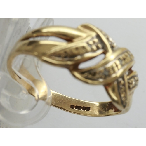 29 - 9ct gold crossover ring set with diamonds, size K/L, 1.9g. P&P Group 1 (£14+VAT for the first lot an... 