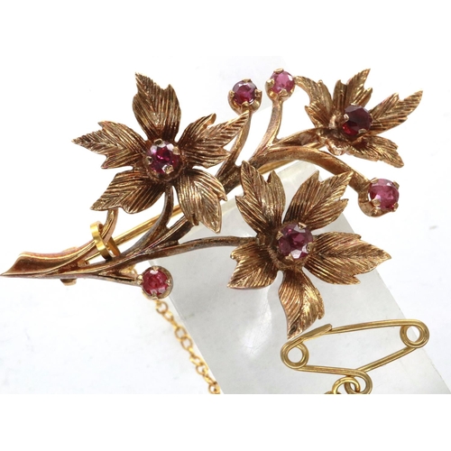 34 - 9ct gold flower form brooch set with seven rubies, H: 50 mm, 6.5g. P&P Group 1 (£14+VAT for the firs... 