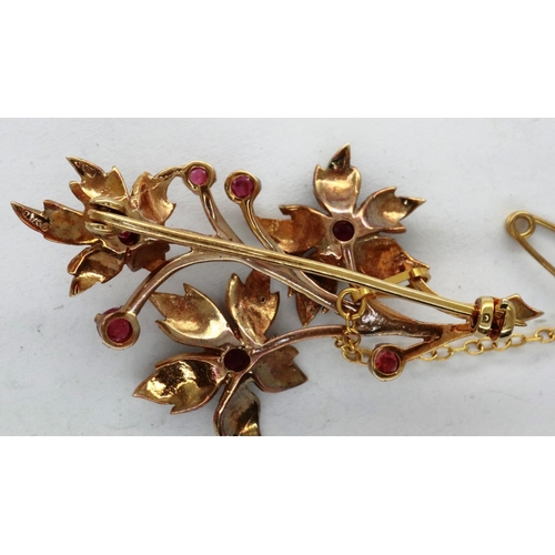 34 - 9ct gold flower form brooch set with seven rubies, H: 50 mm, 6.5g. P&P Group 1 (£14+VAT for the firs... 