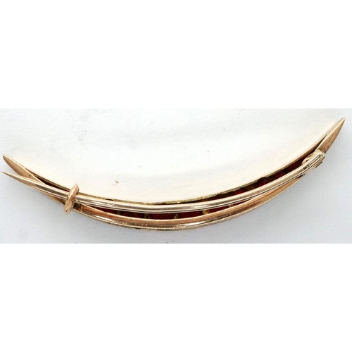 43 - Victorian 9ct rose gold crescent brooch, set with thirteen graduated red stones, L: 50 mm, 2.9g. P&P... 