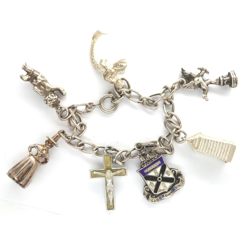 44 - 925 silver charm bracelet, with seven charms, L: 18 cm. P&P Group 1 (£14+VAT for the first lot and £... 