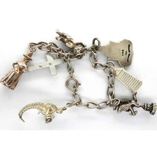 44 - 925 silver charm bracelet, with seven charms, L: 18 cm. P&P Group 1 (£14+VAT for the first lot and £... 