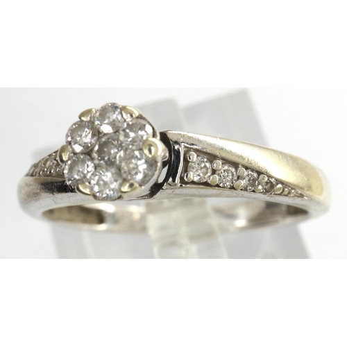 65 - 9ct gold diamond flower-head cluster ring, size M, 2.2g. P&P Group 1 (£14+VAT for the first lot and ... 