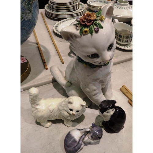 1423 - Four modern ceramic cat ornaments including Royal Copenhagen. Not available for in-house P&P