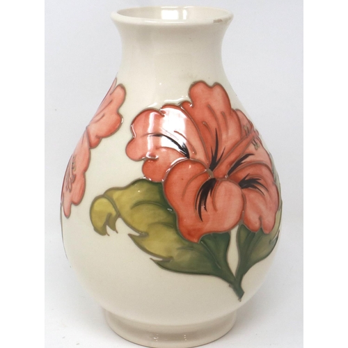 244 - Moorcroft cream ground bulbous vase, in the Hibiscus pattern, H: 20 cm, small chips to rim of vase. ... 