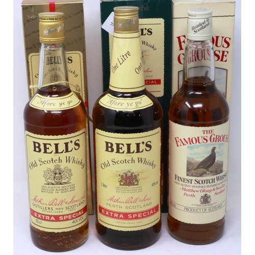 534 - The Famous Grouse 75cl whisky, with one Bells Extra Special 75cl and one 1 litre whisky, each 40% pr... 