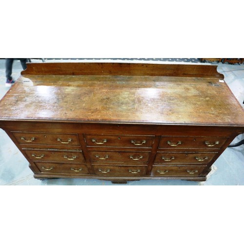 2121 - An early 19th century Lancashire chest, with lifting top above six drawers and raised on bracket fee... 