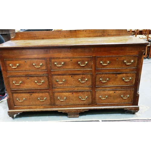 2121 - An early 19th century Lancashire chest, with lifting top above six drawers and raised on bracket fee... 