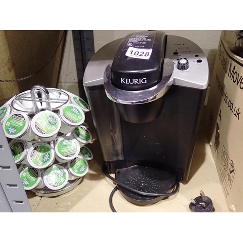 1028 - Keurig coffee machine, model KL40, with a quantity of coffee pods on a stand. P&P Group 3 (£25+VAT f... 