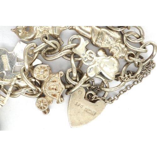 28 - Hallmarked silver charm bracelet with twelve charms, and hallmarked silver clasp, L: 18 cm, combined... 