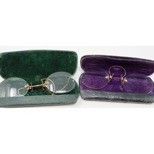 130 - Two pairs of Victorian spectacles, in leather cases, damaged. P&P Group 1 (£14+VAT for the first lot... 