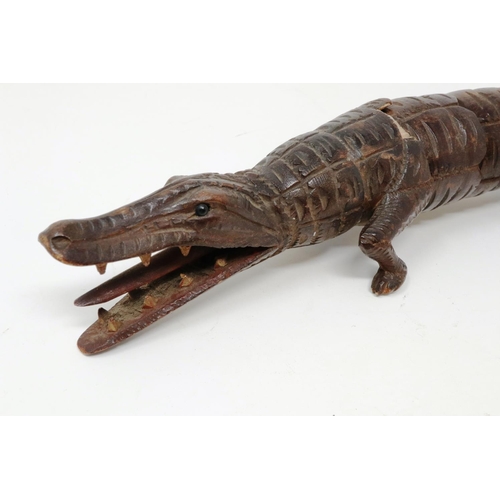 146 - 19th century carved wood articulated crocodile, L: 31 cm, one visible repair and loss to body. P&P G... 