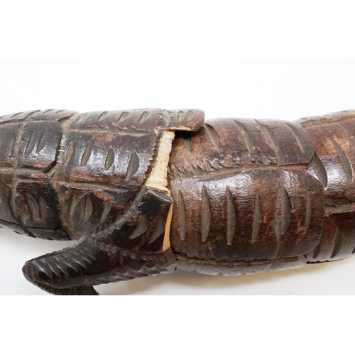 146 - 19th century carved wood articulated crocodile, L: 31 cm, one visible repair and loss to body. P&P G... 