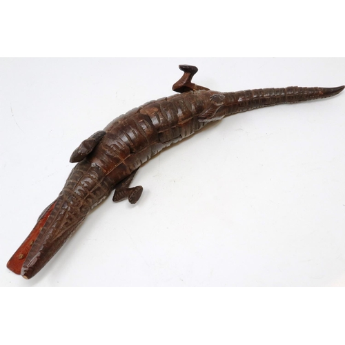 146 - 19th century carved wood articulated crocodile, L: 31 cm, one visible repair and loss to body. P&P G... 