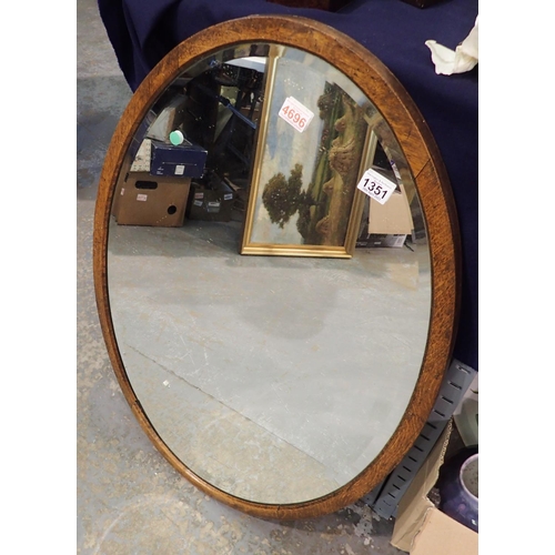 1351 - Large oak framed oval wall mirror, 70 x 100 cm. Not available for in-house P&P