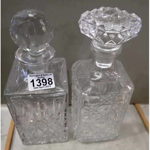 1398 - Two crystal decanters and a pair of ceramic wall pockets. Not available for in-house P&P