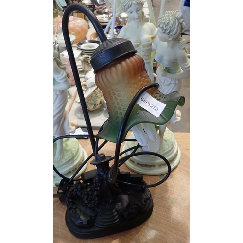 1434 - Bronze effect figural lamp with coloured glass shade, H: 43 cm. Not available for in-house P&P